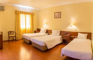 Cama ou camas em um quarto em Hotel Belsol