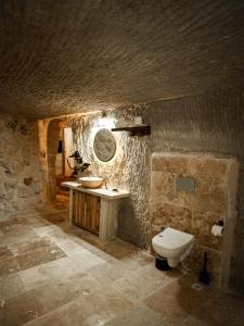 a bathroom with a sink and a toilet in a cave at Lost City Cappadocia in Nar +211 photos