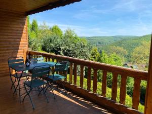 a table and chairs on a balcony with a view at Refugium Augustin in Vienna