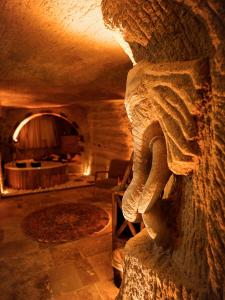 a stone statue of an animal in a room at Lost City Cappadocia in Nar