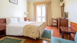 Cama ou camas em um quarto em Hotel Belsol