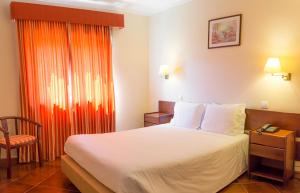Cama ou camas em um quarto em Hotel Belsol