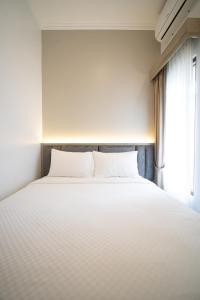 Llit o llits en una habitació de Villa AWLS & Resort Puncak
