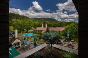 an aerial view of a house with a playground at Penzion Zubr in Ujčov