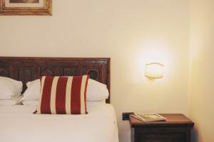 Postel nebo postele na pokoji v ubytování Hotel Galileo