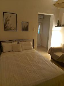 a bedroom with a large bed with two pillows at CITY CENTER APARTMENT in Sparta