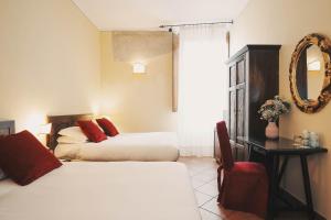 Postel nebo postele na pokoji v ubytování Hotel Galileo