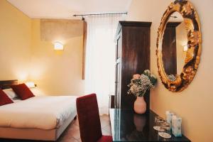 Postel nebo postele na pokoji v ubytování Hotel Galileo