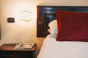 Postel nebo postele na pokoji v ubytování Hotel Galileo