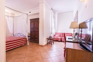 Postel nebo postele na pokoji v ubytování Hotel Galileo