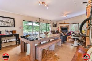a kitchen with a large wooden island in a room at Cinzaco Dullstroom in Dullstroom
