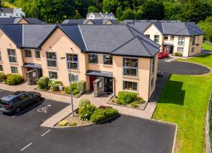 an aerial view of a house with a parking lot at Lakeside HH No 30 - 2 Bed in Killaloe
