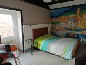 Una cama o camas en una habitación de L'orée des 3 Rivières