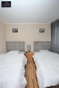 Letto o letti in una camera di Tamara Pyramids Inn
