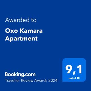 a blue text box with the words awarded to oxo karmaarma appointment at Oxo Kamara Apartment in Karpathos Town