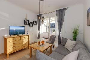 TV a/nebo společenská místnost v ubytování Apartment-Residenz Ostseestrand Apartment-Residenz Ostseestrand 21