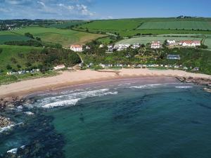 an aerial view of a beach and the ocean at 2 Bed in Coldingham 93242 in Duns