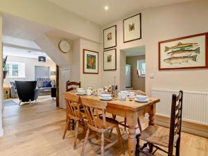 a dining room and living room with a table and chairs at 3 Bed in Leominster 93304 in Bodenham