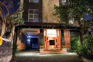 a front door of a building at night at The Visala Boutique Suites Seminyak in Seminyak