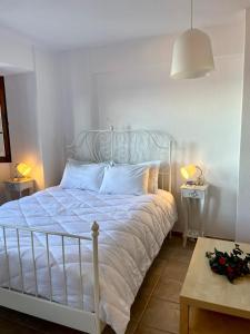 A bed or beds in a room at Aegean View House