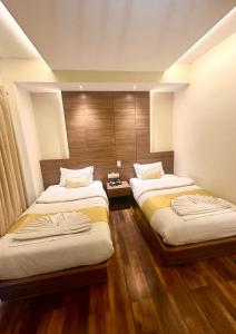 A bed or beds in a room at Hotel Bihani