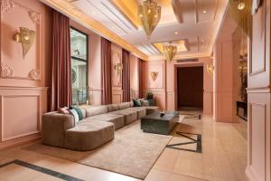a living room with a couch and a table at VISIONAPARTMENTS Bucharest - contactless check-in in Bucharest