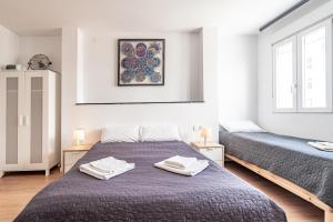 Postel nebo postele na pokoji v ubytování Jardín Botánico Rooms