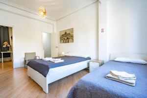 Postel nebo postele na pokoji v ubytování Jardín Botánico Rooms