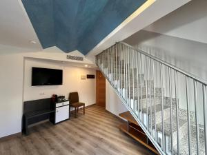 TV a/nebo společenská místnost v ubytování Antídoto Rooms Zocodover Check-in on line