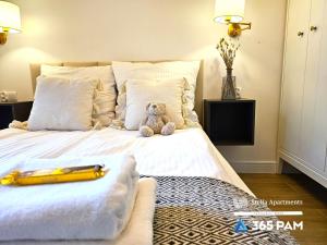 Lova arba lovos apgyvendinimo įstaigoje Apartamenty Harmonia - 365PAM