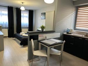 Posedenie v ubytovaní H-T-L Apartamenty Junior