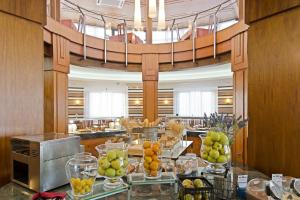 a lobby with a bunch of fruit on a table at Elba Lucía Sport & Suite Hotel in Costa de Antigua