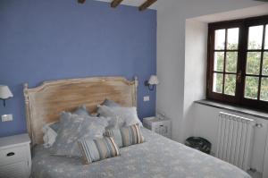 Giường trong phòng chung tại La Villa di Augusto