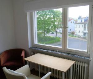 Posezení v ubytování Ruhige 4-Zi-Wohnung mit großem Balkon und Blick ins Grüne