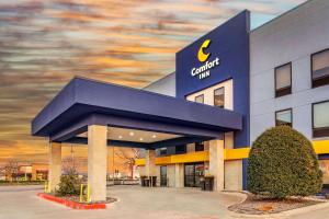 a building with a sign on the side of it at Comfort Inn - Weatherford in Weatherford