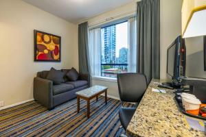 a living room with a couch and a window at Quality Inn & Suites in Vancouver