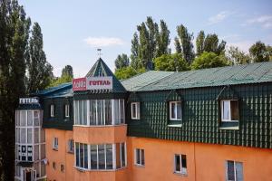 a building with a sign on top of it at Hotel LaMa 2 in Kyiv