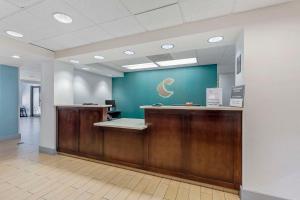 an office lobby with a desk with a crescent moon on the wall at Comfort Inn Laurel - Fort Meade in Laurel