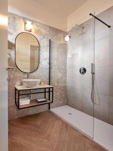 a bathroom with a sink and a shower at Hotel Antica Fonte in Brescia