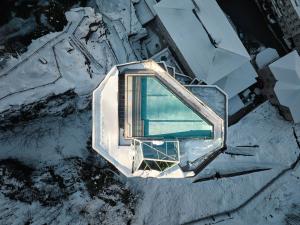 an aerial view of a building in the snow at Badeschloss in Bad Gastein
