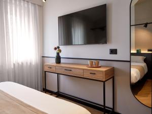 En eller flere senge i et værelse på Hotel Antica Fonte