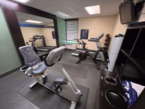 a gym with several exercise bikes and tread machines at Cherokee Inn in Cherokee