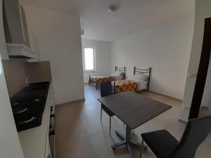 a living room with a table and a couch at Irpinia Verde in Mirabella Eclano