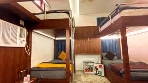 a bedroom with two bunk beds in a room at The Vacation Villa in Agra