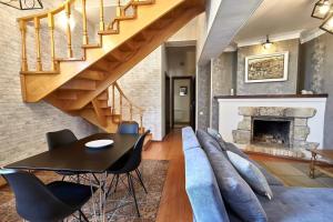 a living room with a couch and a table at Iliani Hotel in Tbilisi City