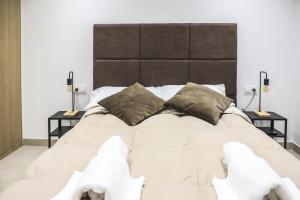 Posteľ alebo postele v izbe v ubytovaní Apartamentos Sudestada