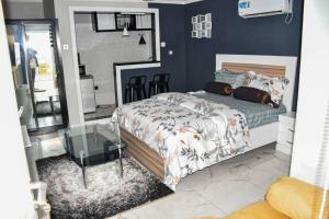 מיטה או מיטות בחדר ב-Movomo Limbe