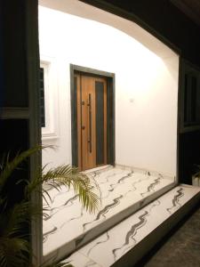 a hallway of a house with a door at Inviting 2-Bed Apartment in Ifako-Ijaiye in Lagos