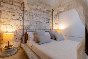 Relais Porta del Sud客房内的一张或多张床位