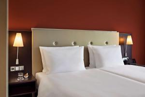 Cama o camas de una habitación en Dorint Hotel Esplanade Jena